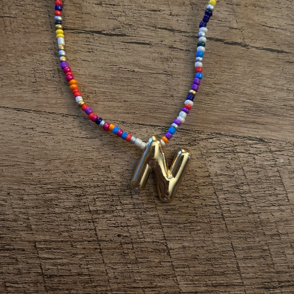 Colorful Beaded Necklace with Gold Tone Initial N Bubble Letter Pendant